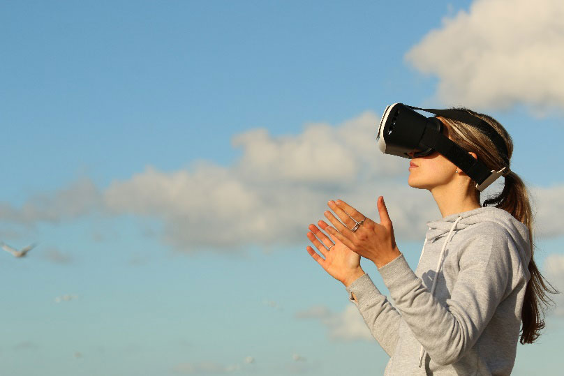 woman wearing a VR headset outside