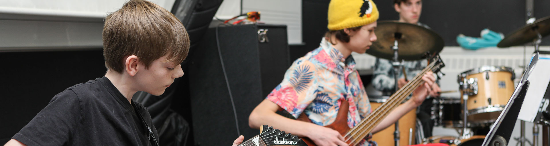 Students playing guitars