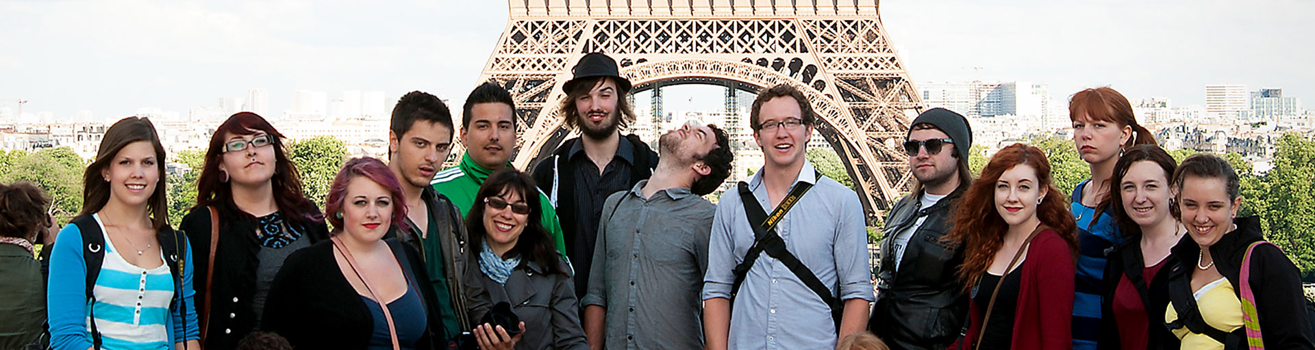 students posing in front of the Eiffel Tower