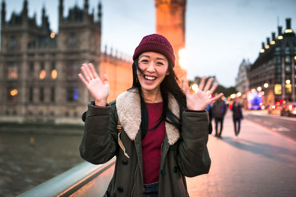 Person outside waving at camera