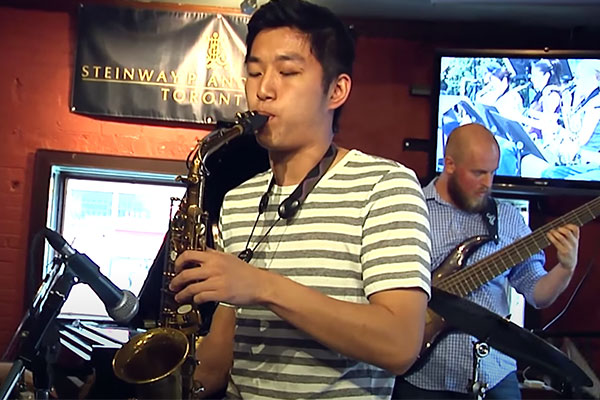 student playing the saxophone