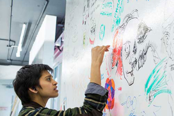 person drawing on a whiteboard