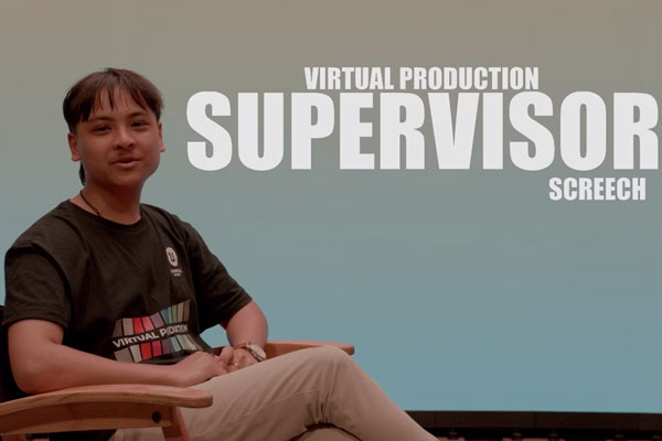 Person seated in chair next to text that reads virtual production supervisor