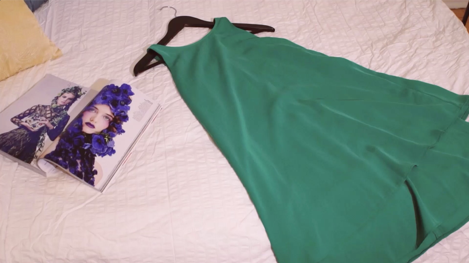 dress laid out on a bed