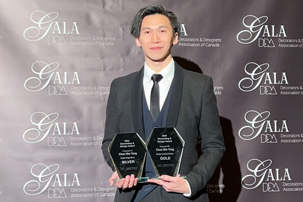 Chun Him Tong holding two awards