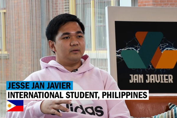 Jesse Jan Javier, student from the Philippines, doing an interview