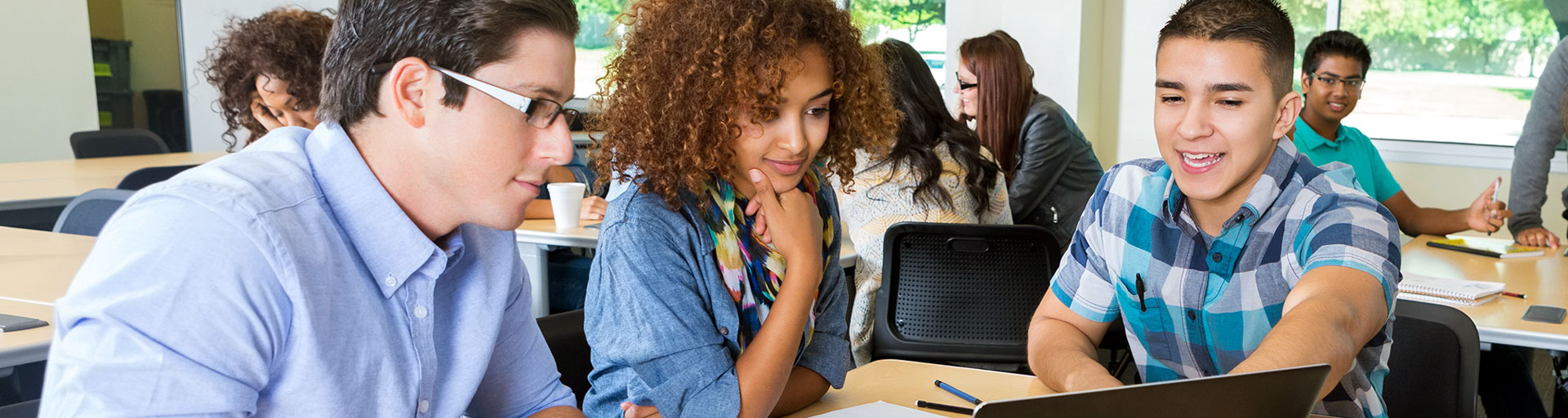 students looking at a laptop