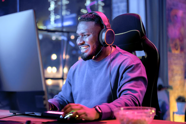 Person on gaming computer smiling