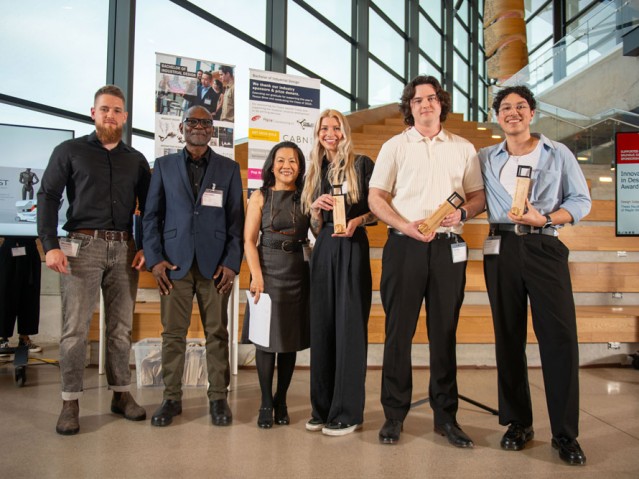 Three students with awards pose for photo with three others