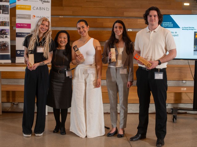 Four awarded students pose with faculty member