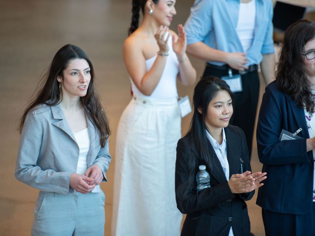 Four people clapping