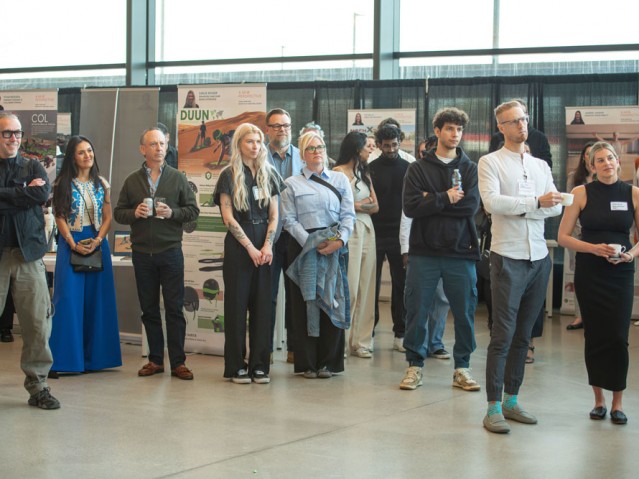 Event guests watching presenter