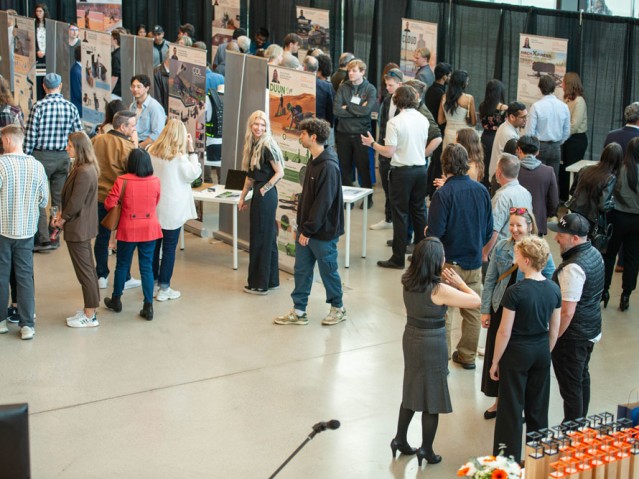 Crowd of people looking at students project displays