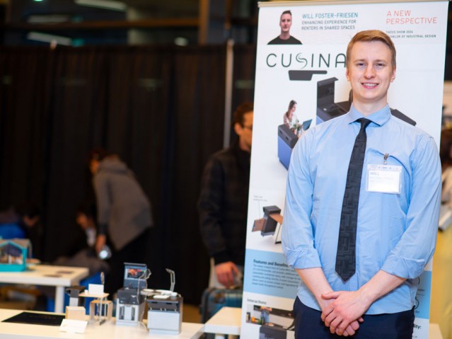 Will Foster-Friesen standing in front of his project poster