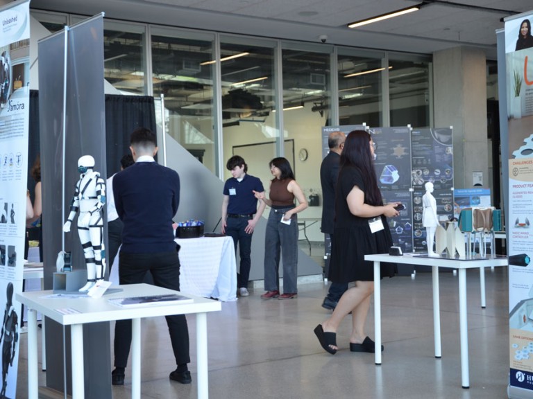 People looking at project displays