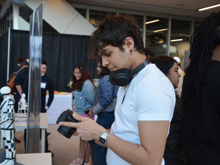 Person looking at at their digital camera