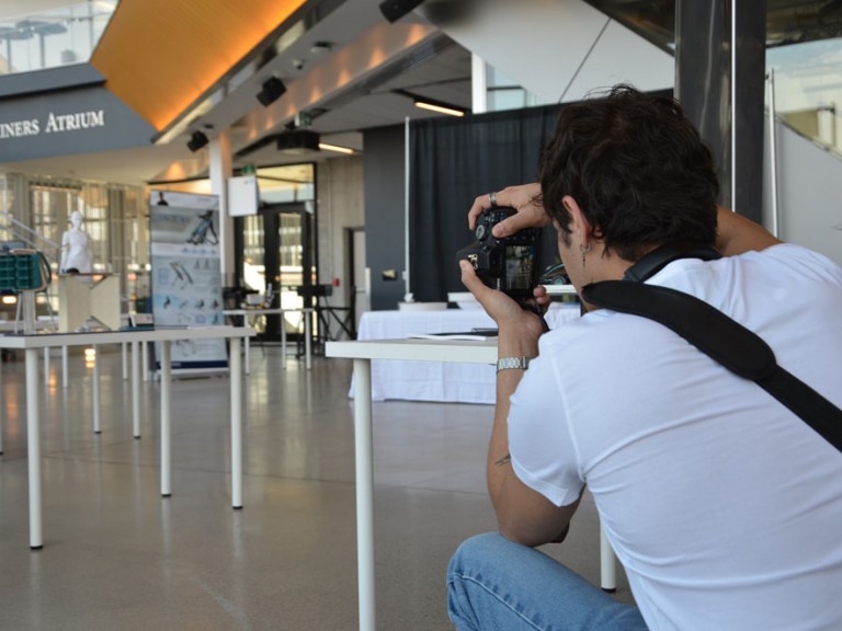 Photographer taking photo of project displays