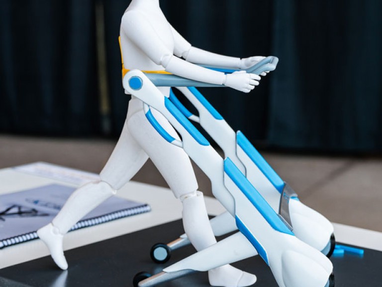 Physical 3D model of figure walking with mobility device