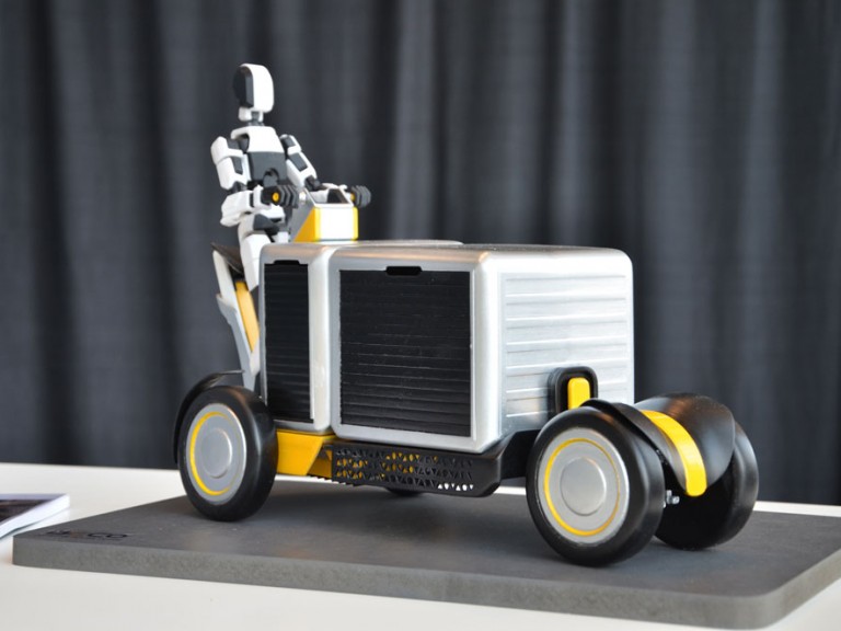 Physical 3D model of figure on a delivery cart vehicle