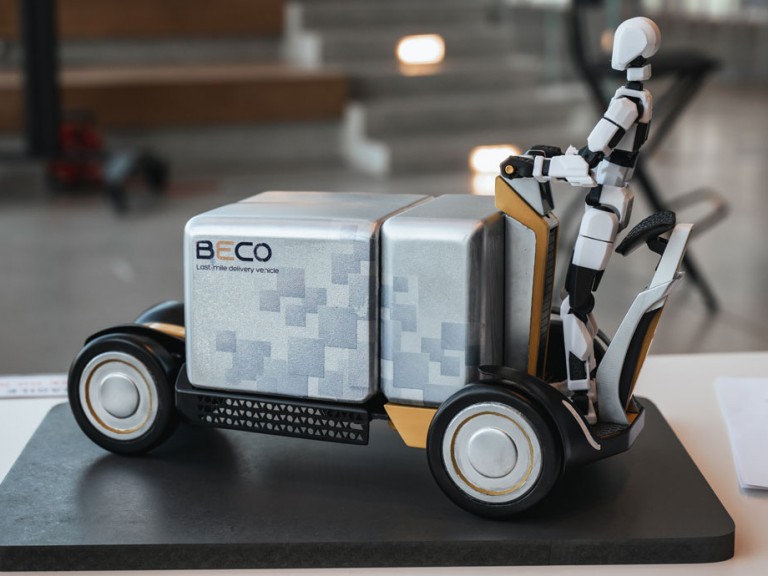 Physical 3D model of figure on a delivery cart vehicle