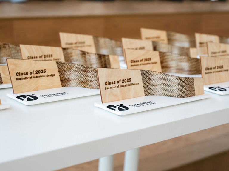 Class of 2025 Bachelor of Industrial design awards on table