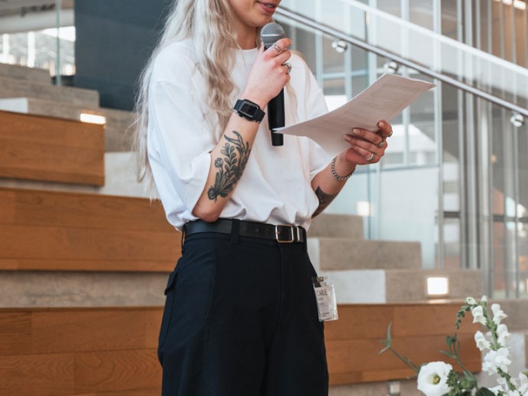 Person speaking into microphone