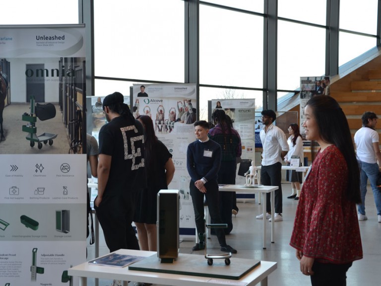 People lingering around project tables
