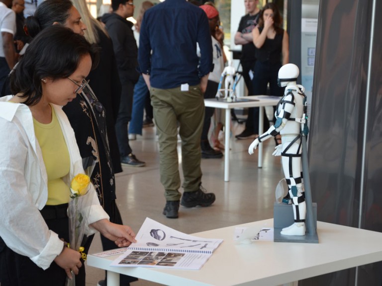 Event guest flipping through project book