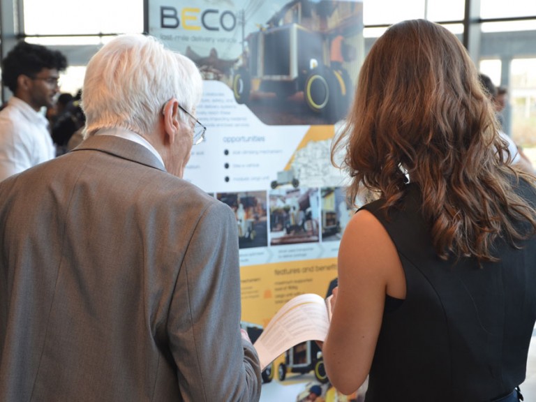 Two people looking at project materials