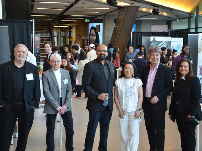 Six people pose for photo