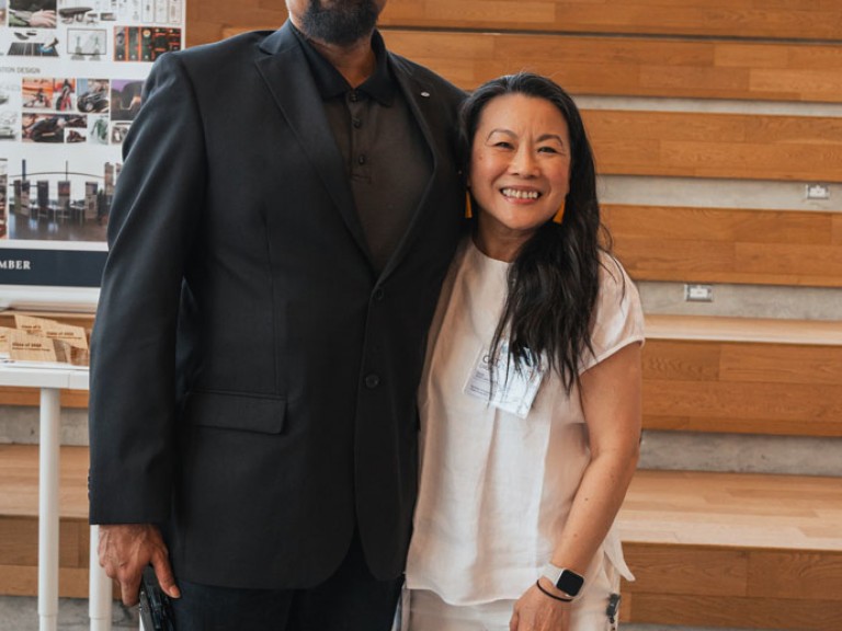 Two people posing for photo together