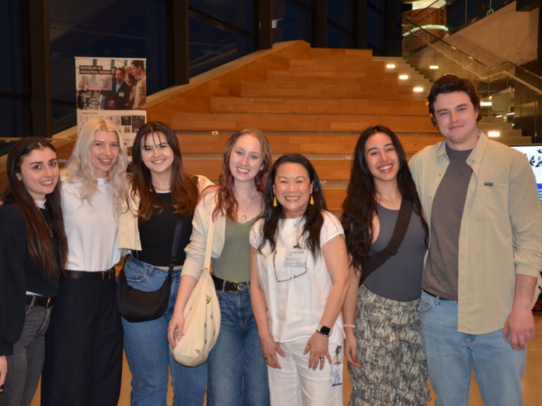Seven people posing for photo