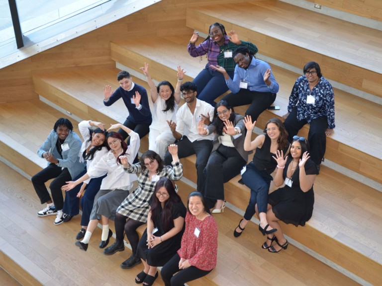 Overhead shot of people on steps posing for photo