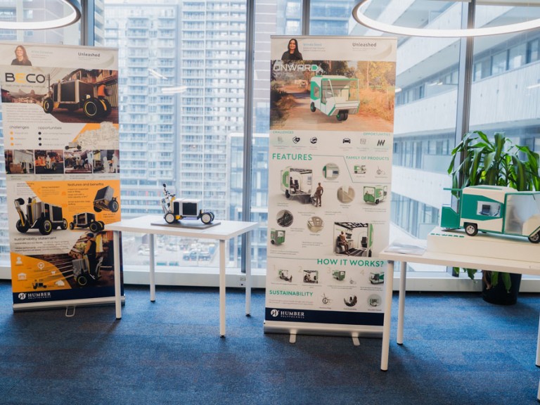 Two project display tables and posters