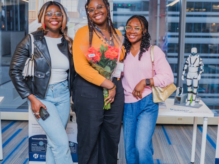Three people smiling for photo