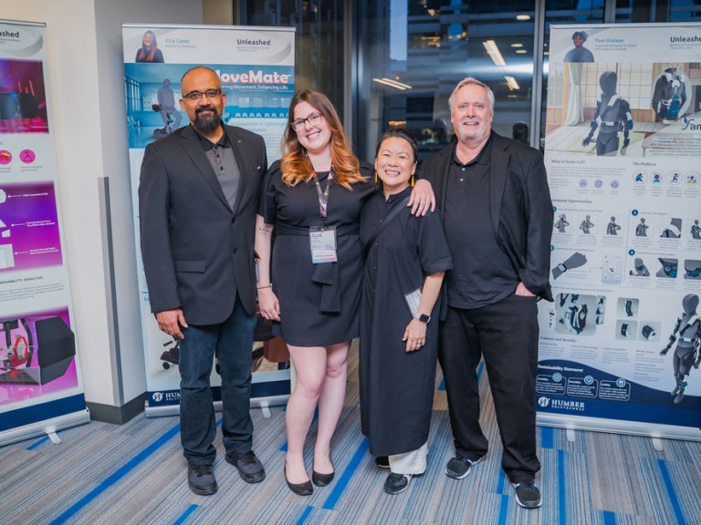 Four people smiling for photo