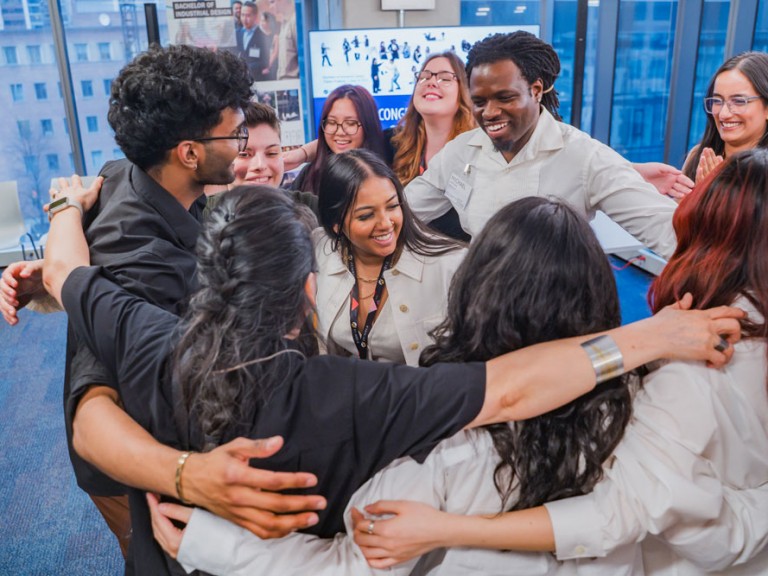 Group of people in a group hug