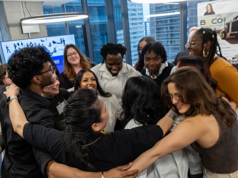 Group of people in a group hug